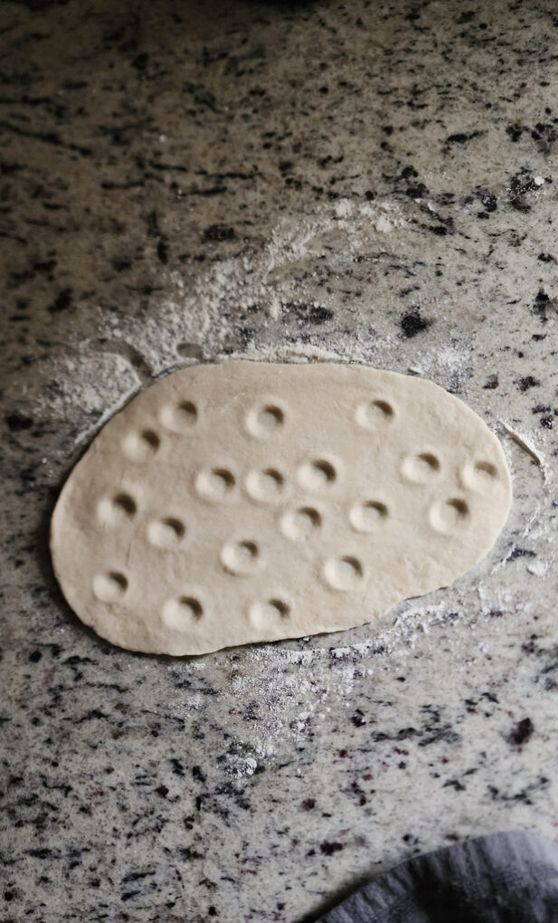 Naan bread dough with dimples