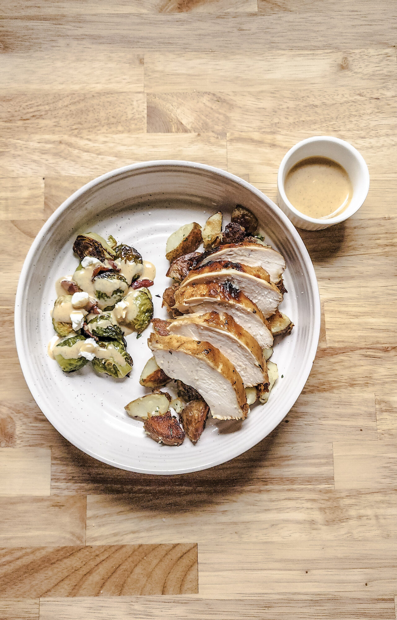 Roast Chicken, served over potatoes with Brussels Sprouts on the Side