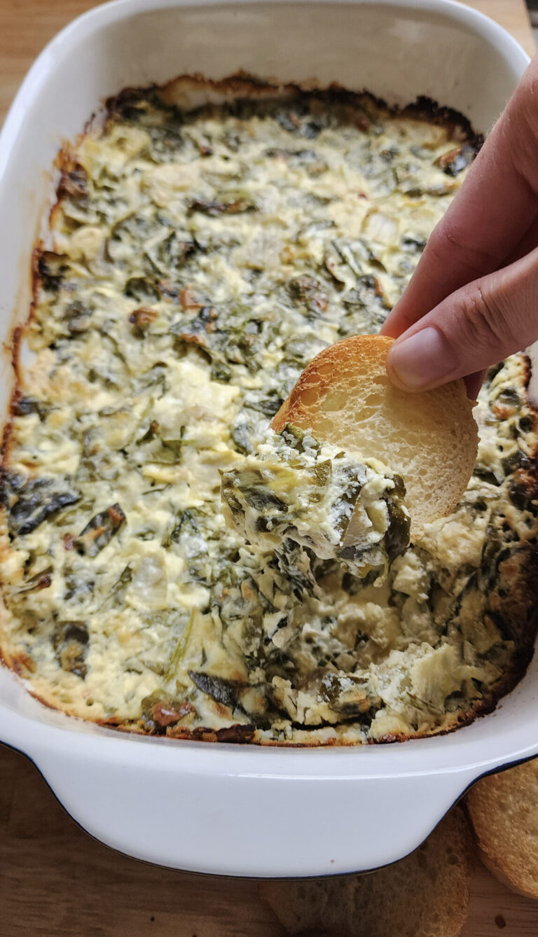 Spinach artichoke dip on a toasted baguette