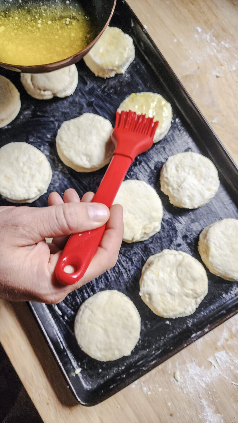 Brushing biscuits with melted butter