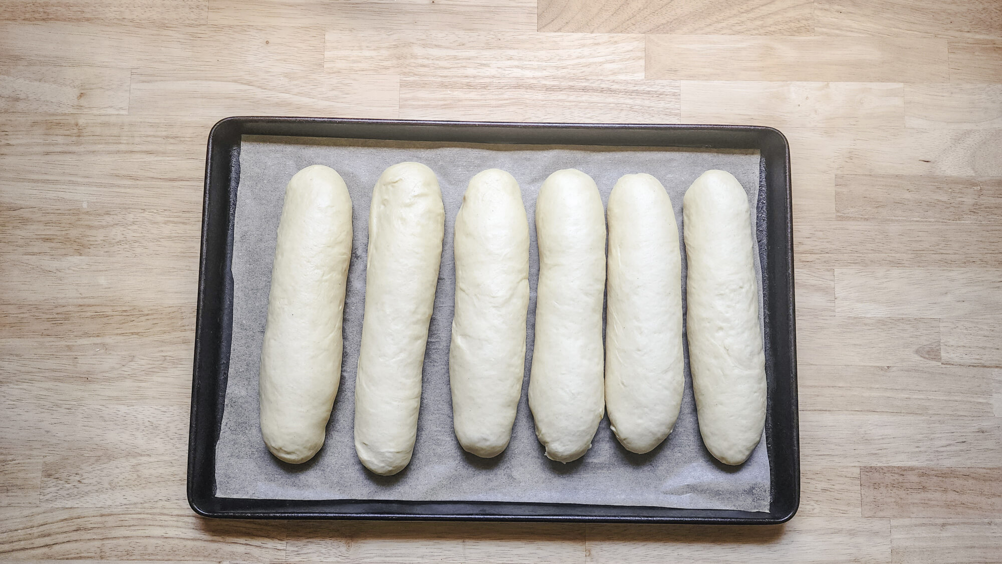 Sub roll loaves after second proof