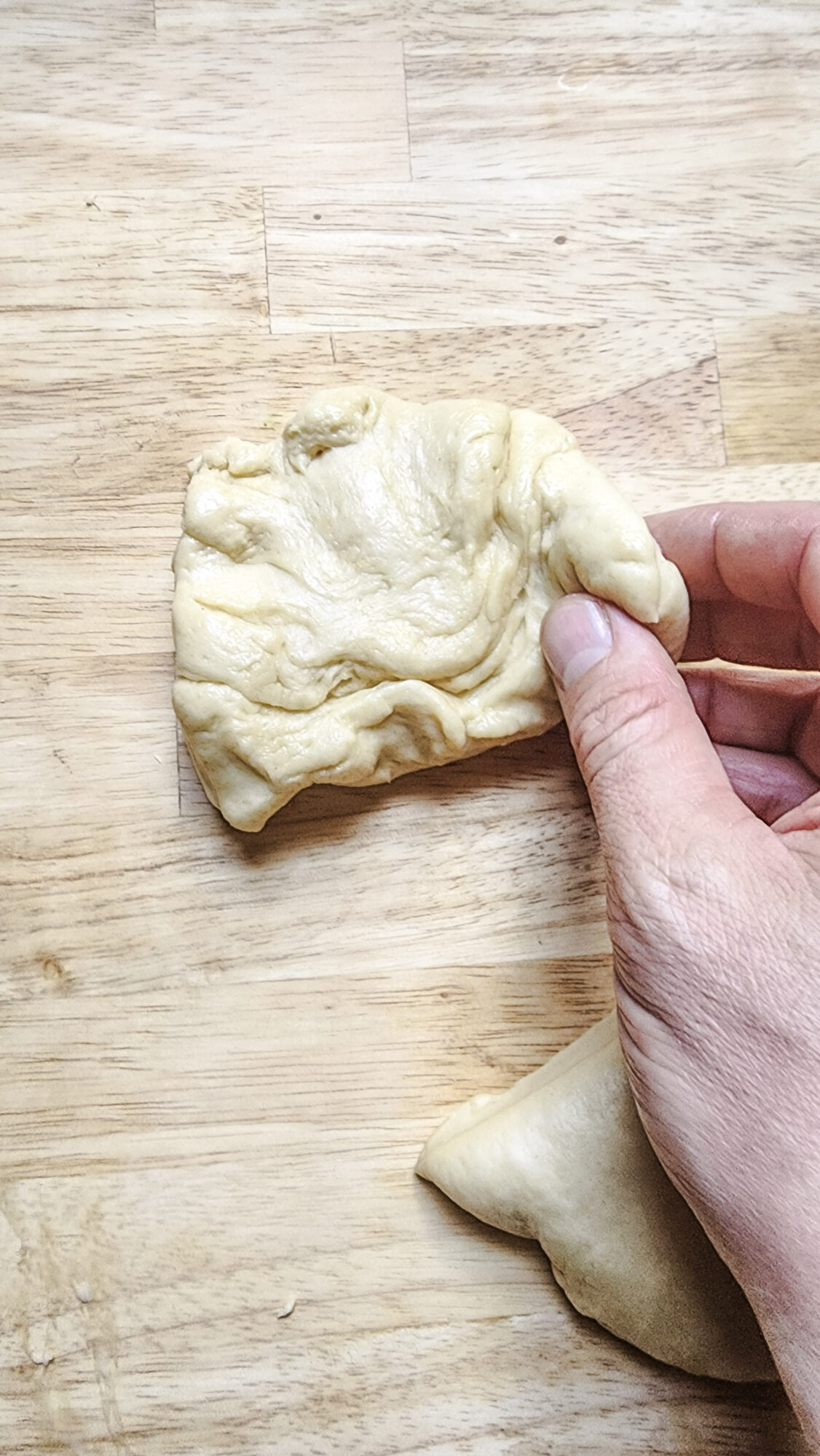 4. Cut the dough into 6 equal pieces, then begin to shape into mini dough balls.