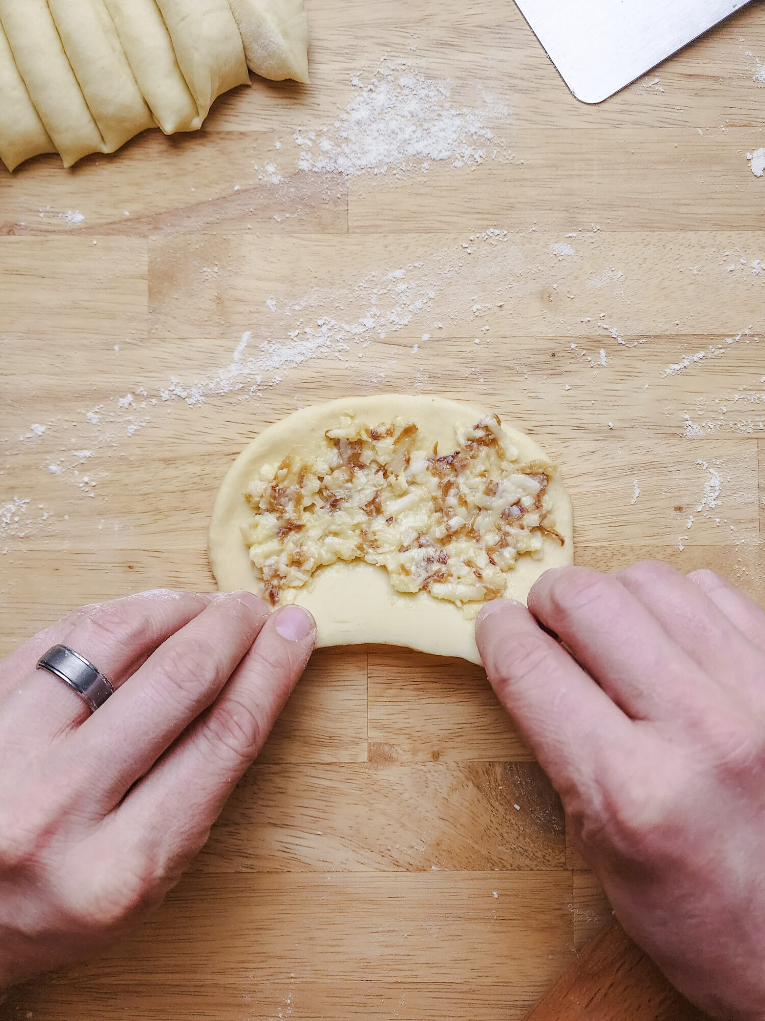 Brioche dough spread with caramelized onion and Gruyere compound butter.