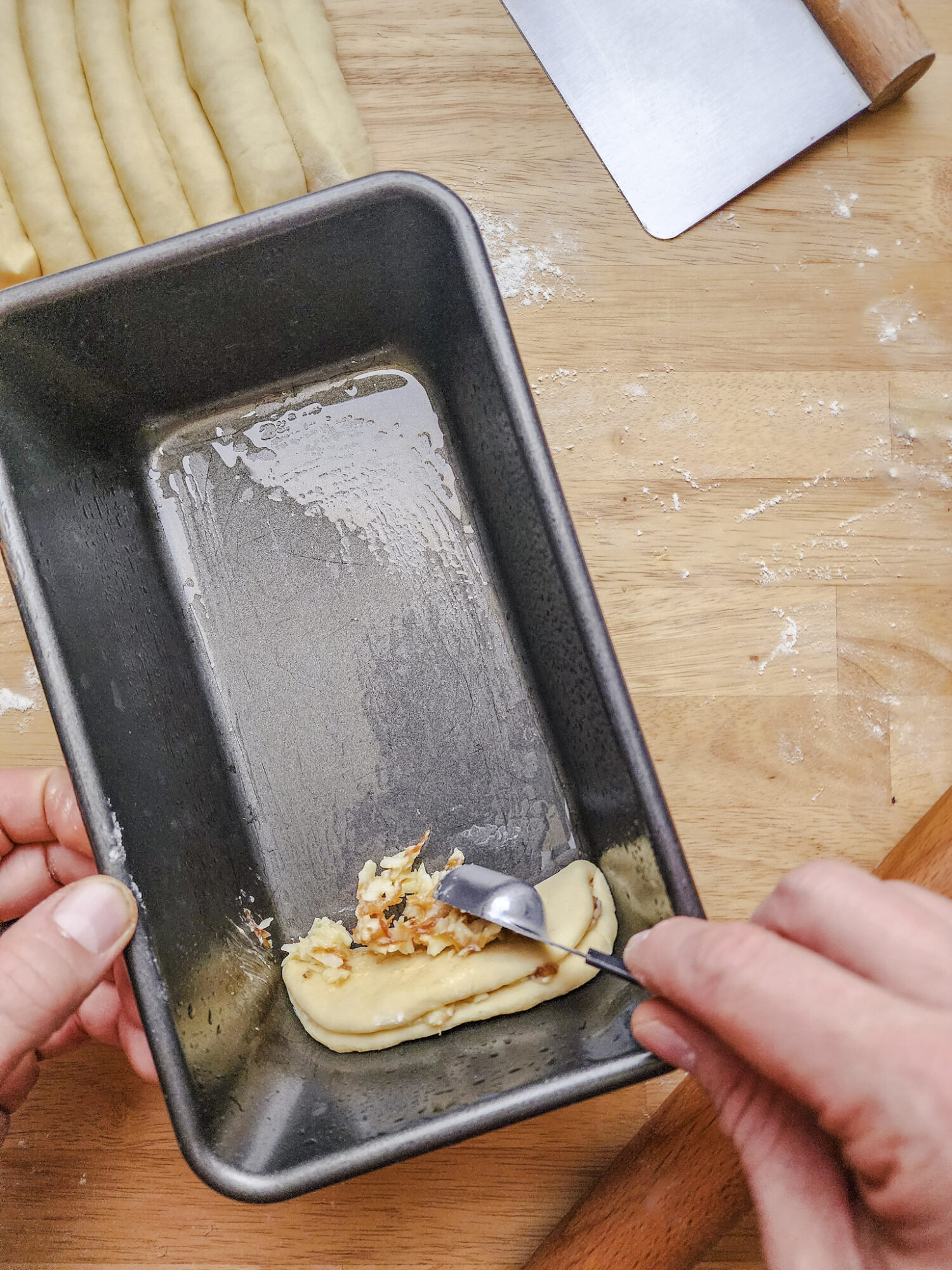 Stacking the pull apart bread dough layers