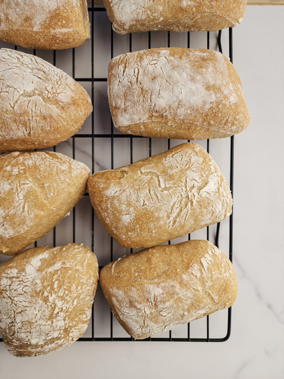 Ciabatta rolls cooling on a wire rack