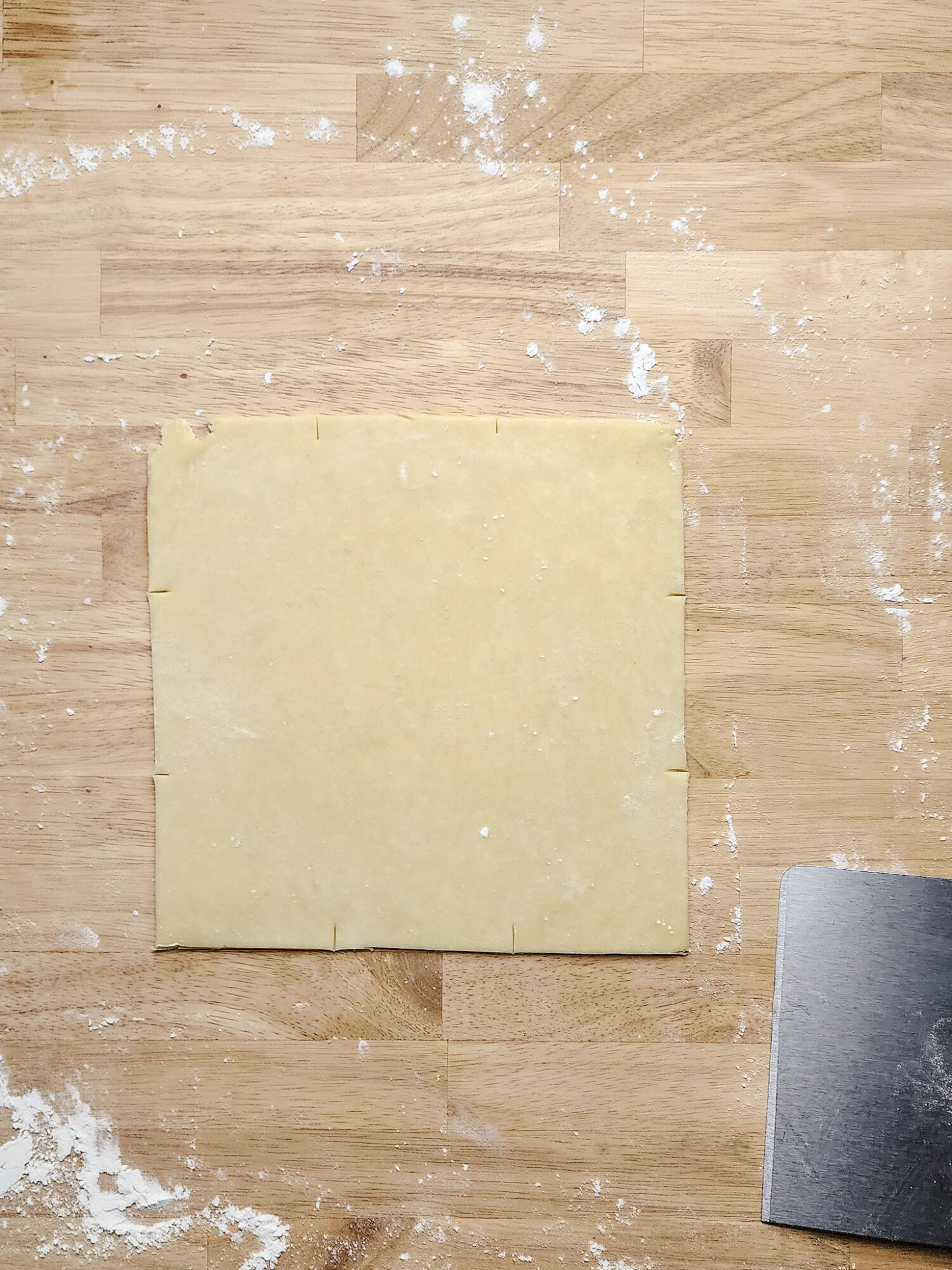 Roll the dough until it's about ⅛th of an inch thick. Typically roll it into a 9 by 12-inch rectangle.