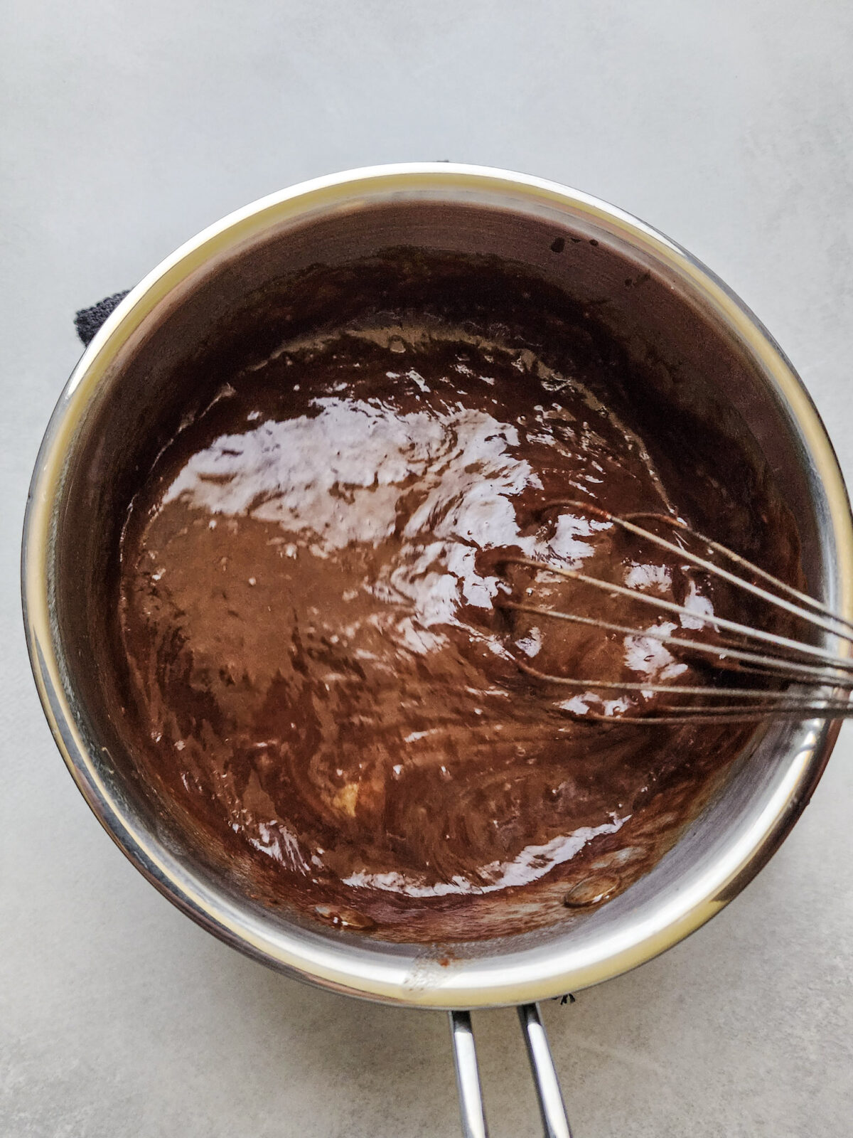 Whisking wet ingredients for Flourless German Chocolate Cake