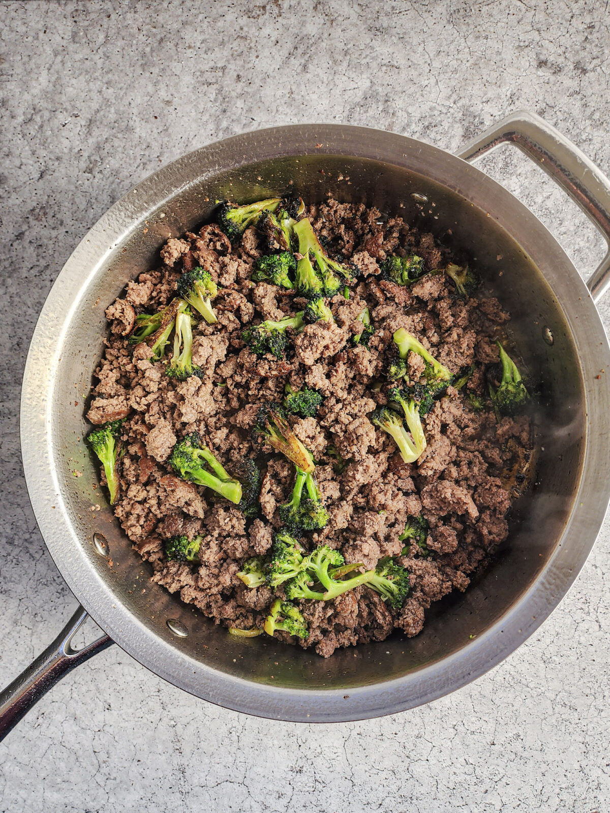 Adding cooked ground beef back to the pan for Korean Ground Beef and Broccoli Bowls