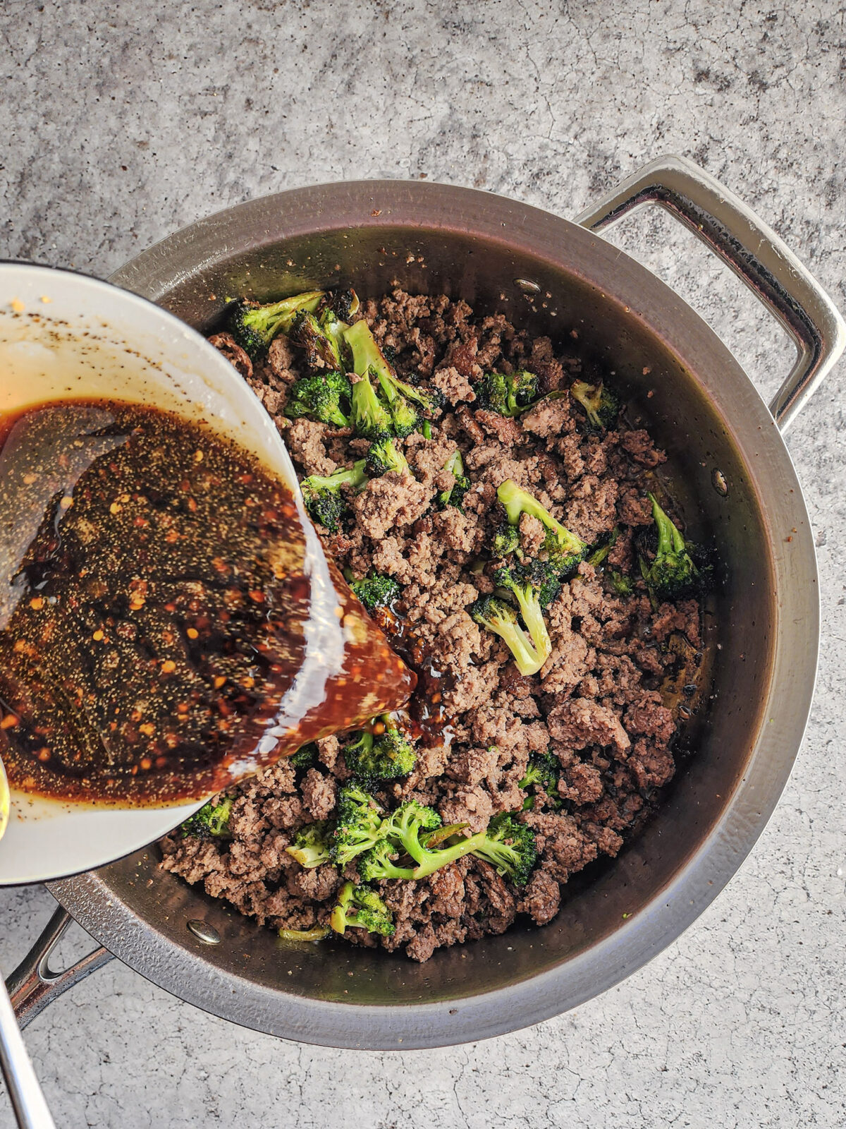 Adding glaze to Korean Beef and Broccoli Bowls