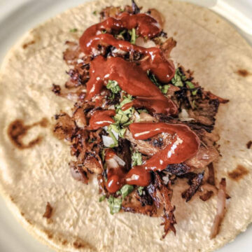 Red Taquería Salsa over a carnitas street taco