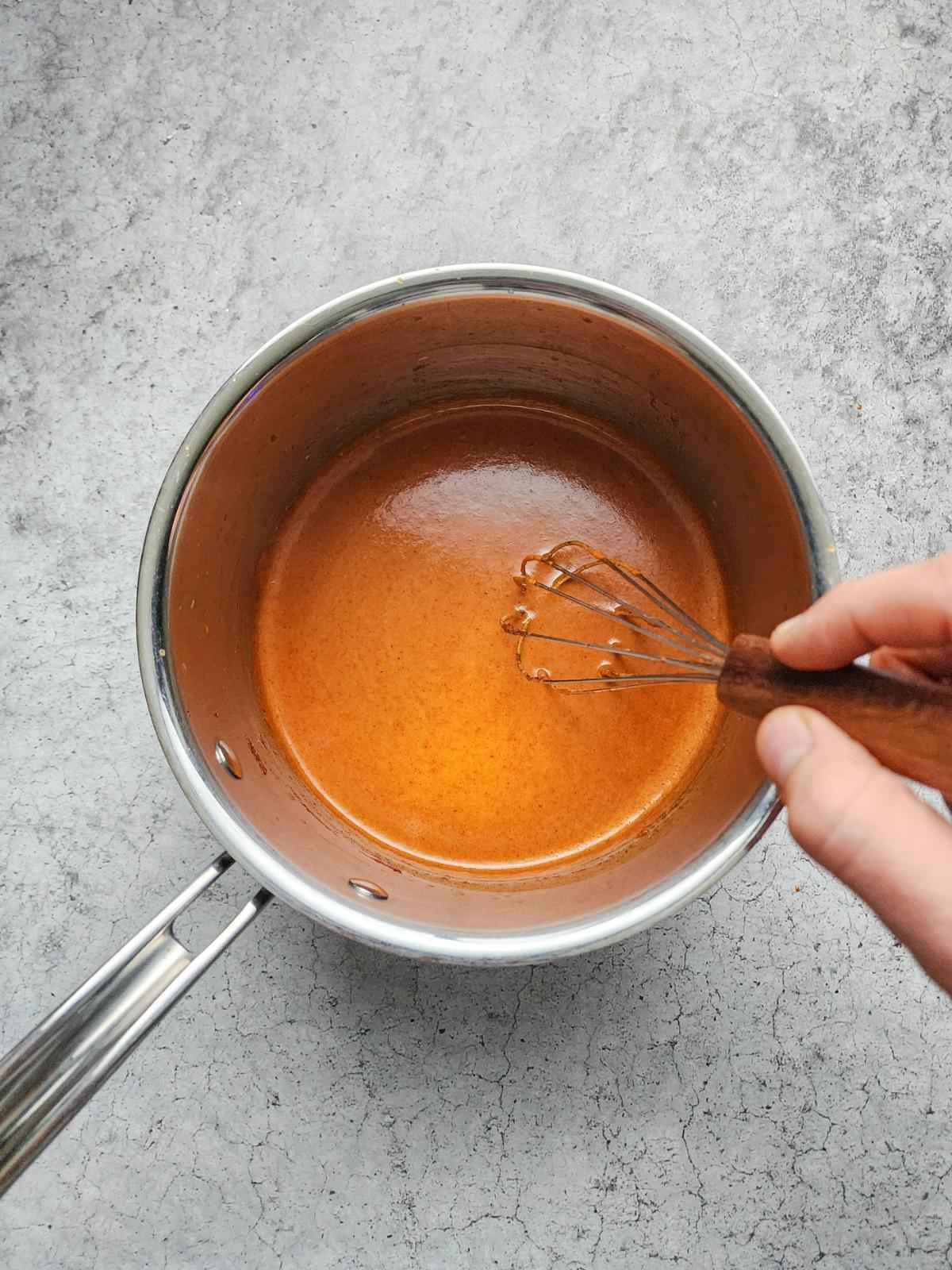 Whisk the sauce together until smooth, then add the vinegar