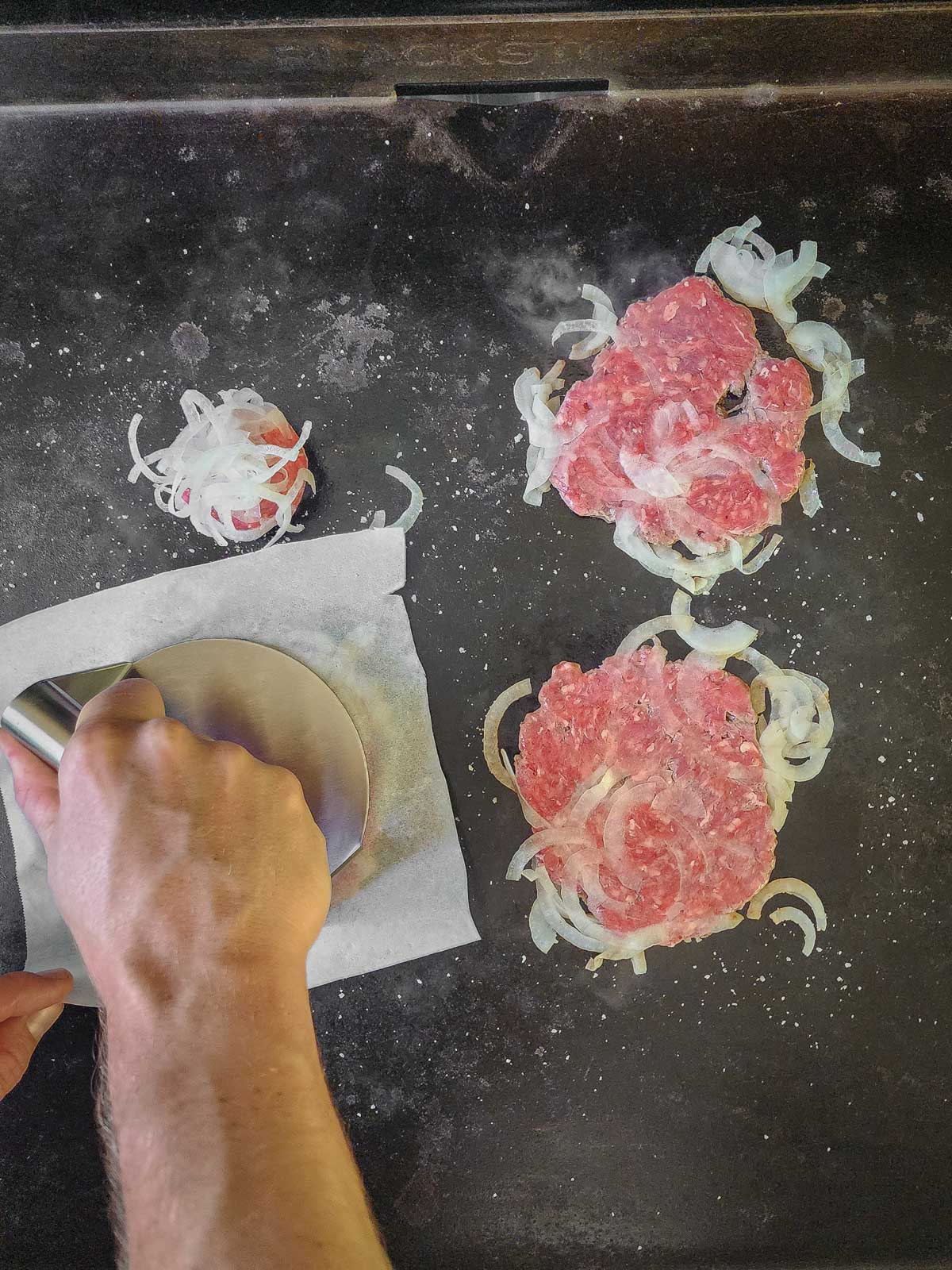 Double Double Animal Style Smash Burger Step 4: Cover each ball of meat with parchment paper, and smash down with a burger press or stiff spatula.