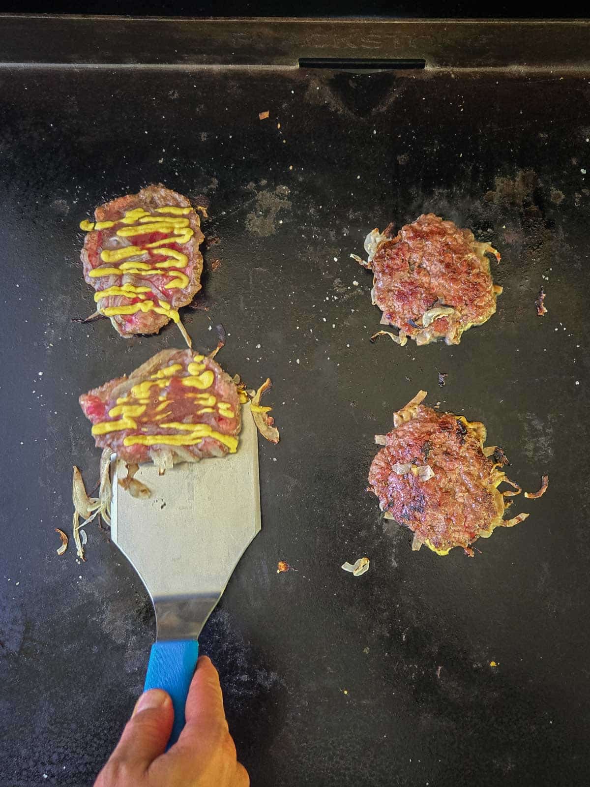 Double Double Animal Style Smash Burger Step 6: Allow the patties to cook for a minute or two, then scrape the patties off the griddle or pan with a stiff spatula when the edges begin to cook and liquid pools on top.