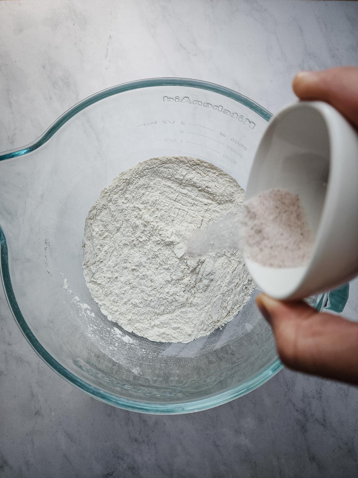 Chai Spiced Cinnamon Rolls Step 2: Combine the dry ingredients in the bowl of a stand mixer.