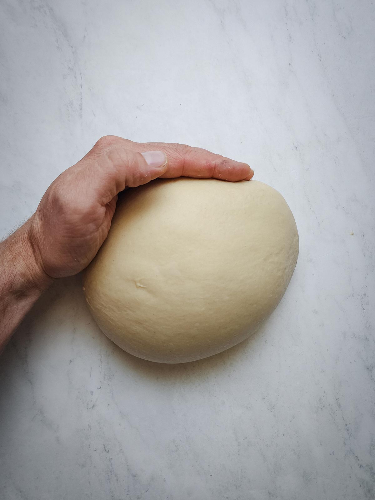 Chai-Spiced Cinnamon Rolls Step 7: Turn the dough out into an un-floured work surface, and shape into a ball.