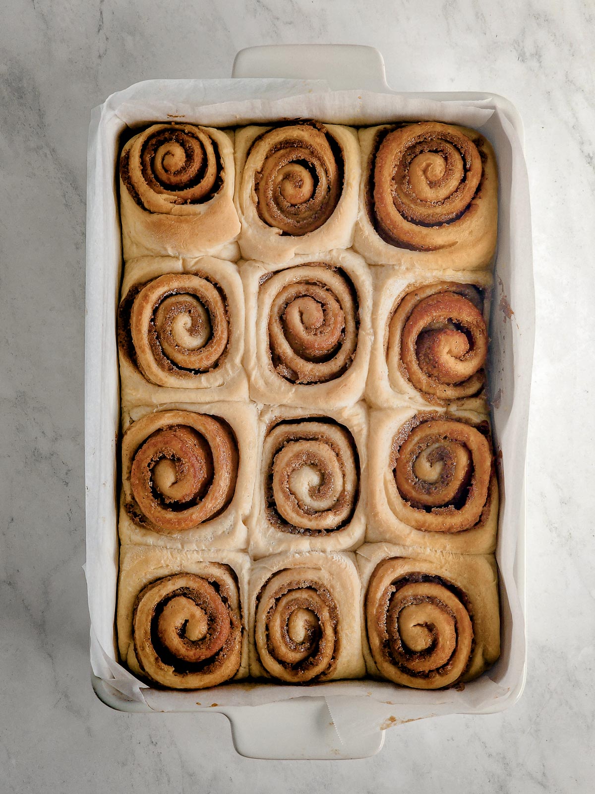 Chai-Spiced Cinnamon Roll - Assembly Step 8: Bake for 25 to 28 minutes until golden brown, and remove from the oven. Allow to cool for 5 to 10 minutes. 