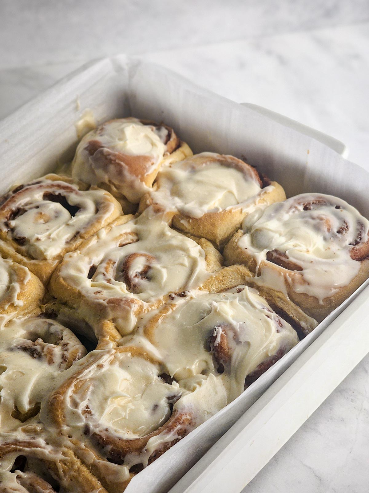 Chai-Spiced Cinnamon Rolls in a baking dish.