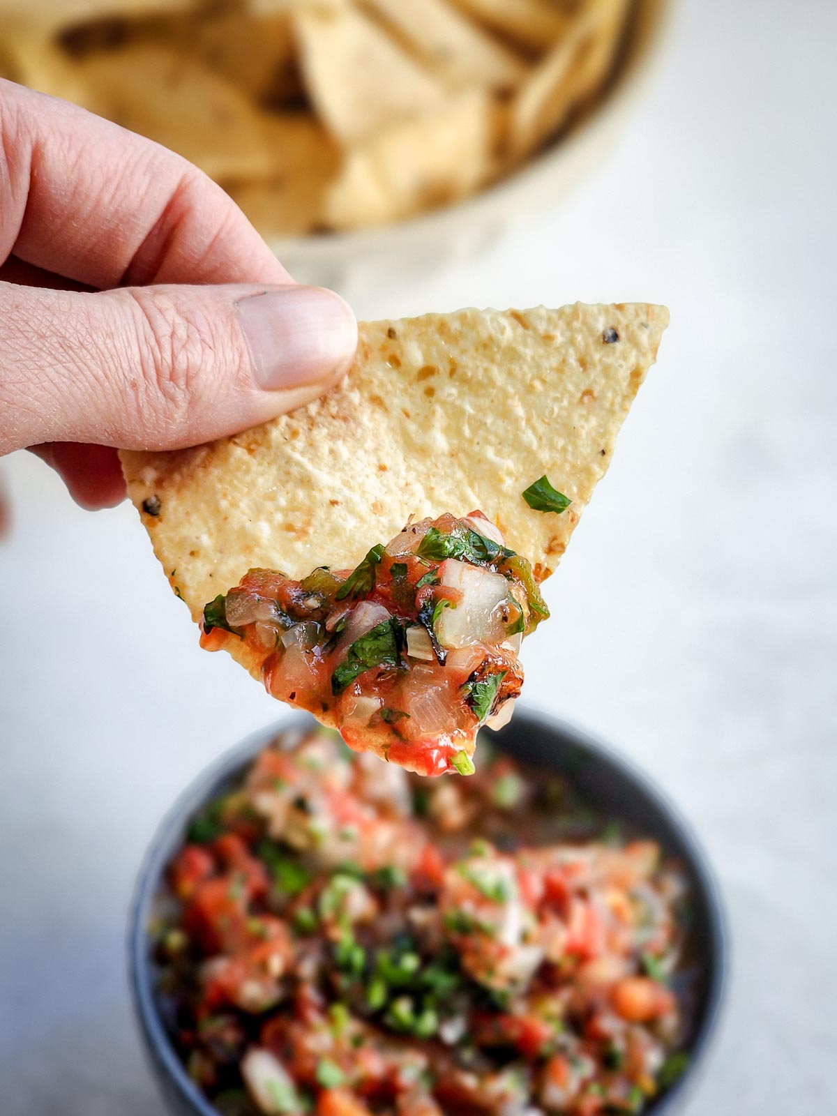 Fire-roasted blowtorch salsa on a tortilla chip.