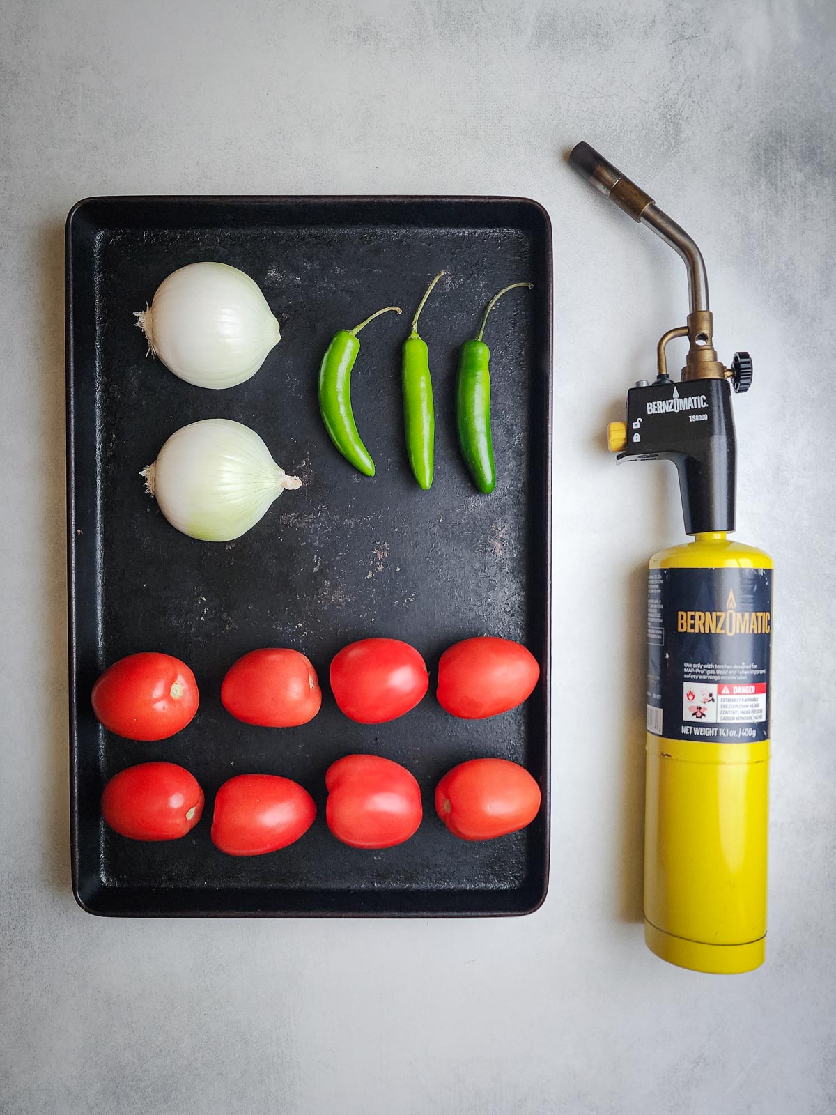 Vegetables and the blowtorch needed for Fire-Roasted Blowtorch Salsa.