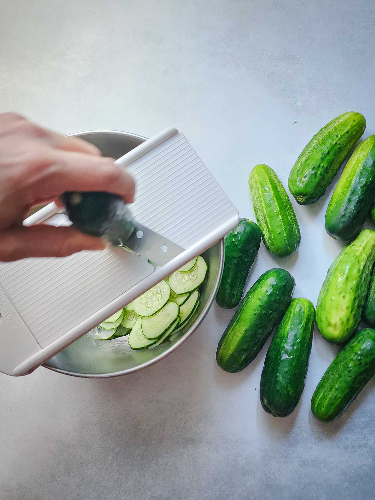 Easy Refrigerator Dill Pickle Slices Step 1: Thinly slice the cucumbers to your desired thickness. I like to keep them relatively thin - no more than ⅛th of an inch.