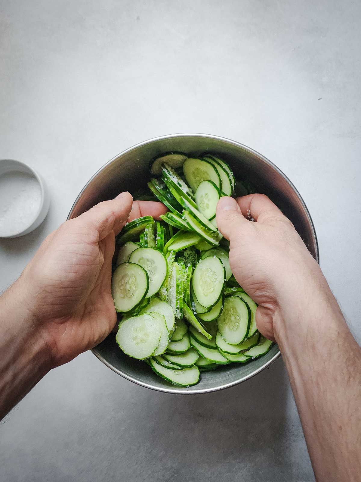 Easy Refrigerator Dill Pickle Slices Step 2: In a large bowl, toss the pickles in kosher salt to evenly coat and let sit for 1 hour.