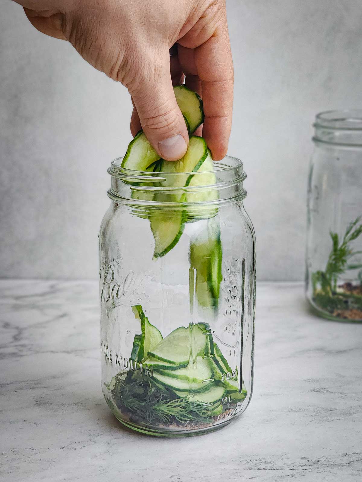 Easy Refrigerator Dill Pickle Slices Step 4: Pack the cucumbers into both jars. Split the remaining liquid from the bottom of the bowl that the cucumbers rested in between each jar. 