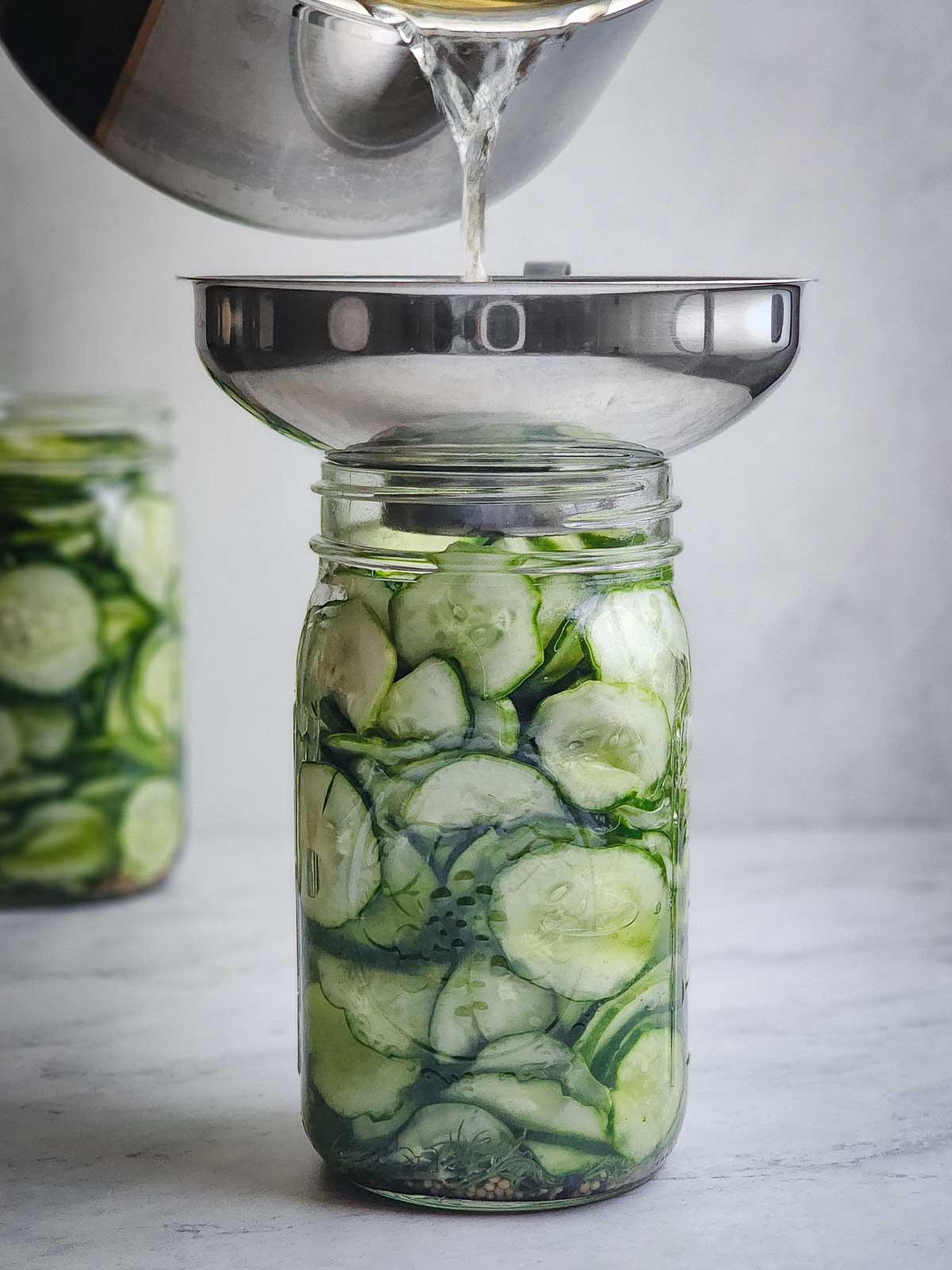 Easy Refrigerator Dill Pickle Slices Step 6: Pour the warm brine evenly over the cucumbers. Fill the jars until the cucumbers are totally submerged. It will fill up most of the jars. Allow to cool, then transfer to the refrigerator and rest overnight.