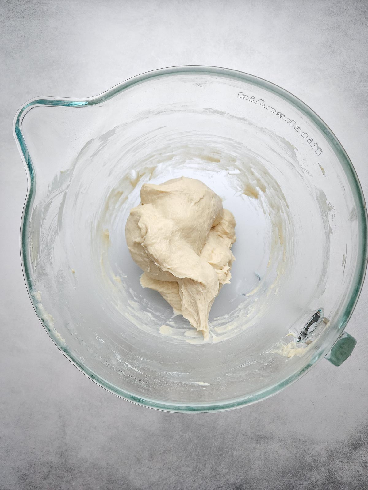 Ultimate Homemade Hamburger Buns Step 4: Add in the softened butter and increase the speed to medium. Knead for 8 to 10 minutes until the dough is very smooth and pulls away from the sides of the bowl.