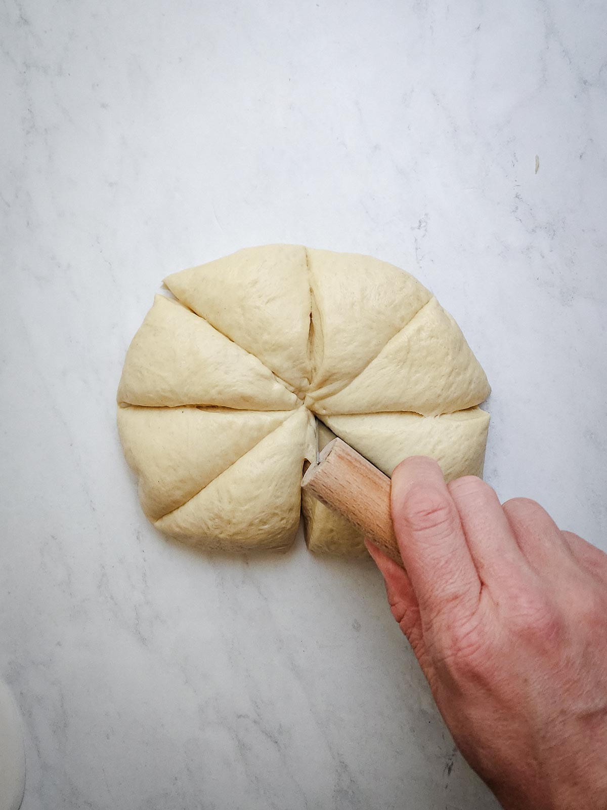 Ultimate Homemade Hamburger Buns Step 6: Punch the dough down, and roll back into a ball. Divide into 8 equal sized pieces, about 75 grams each.